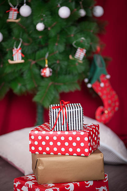 istock Stacks of presents under a Christmas tree 497630534