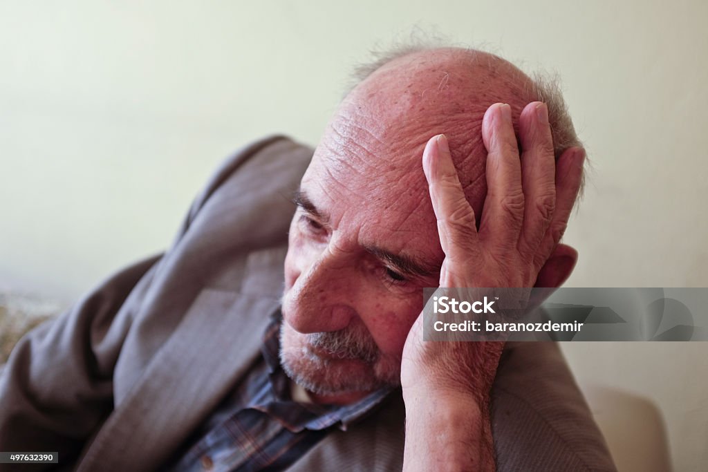 Elderly man lost in thought Portrait Stock Photo