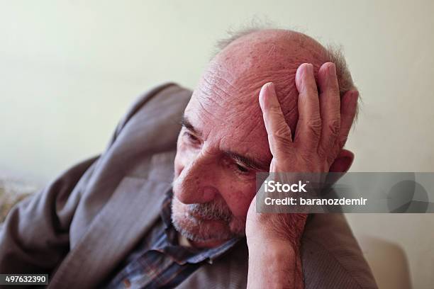 Elderly Man Lost In Thought Stock Photo - Download Image Now - Portrait, Hand In Hair, Senior Adult