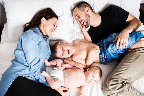 istock Happy family lying in bed 497633378