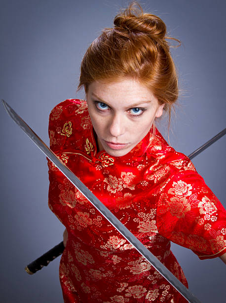 istock Girl in Japanese Outfit with sword 497635108
