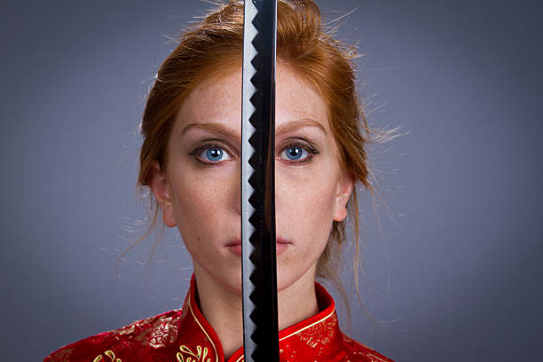 Girl in Japanese Outfit with sword stock photo