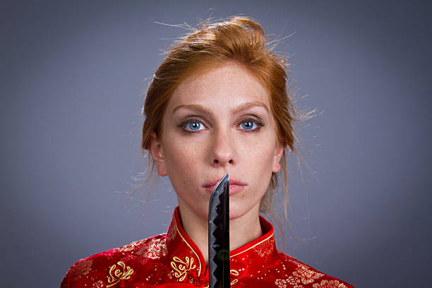 Girl in Japanese Outfit with sword stock photo