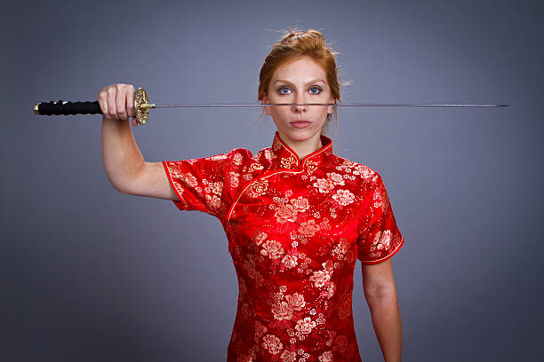 Girl in Japanese Outfit with sword stock photo