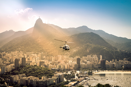 Helicopter flying above Rio de Janeiro Brazil. Sunshine leaks.