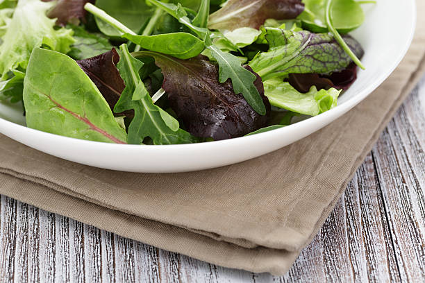 istock mesclun mix salad in white bowl 497635541