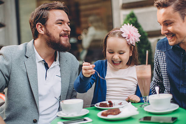 istock Gay Parents with daughter 497636124