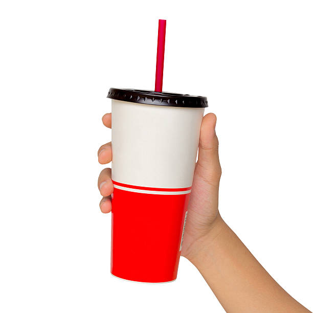 istock Holding a paper cup with tube isolated over white background 497636185