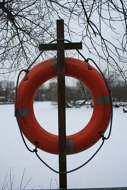 Lifeline in winter, the frozen pond, on the mount, resembling a cross. Russia