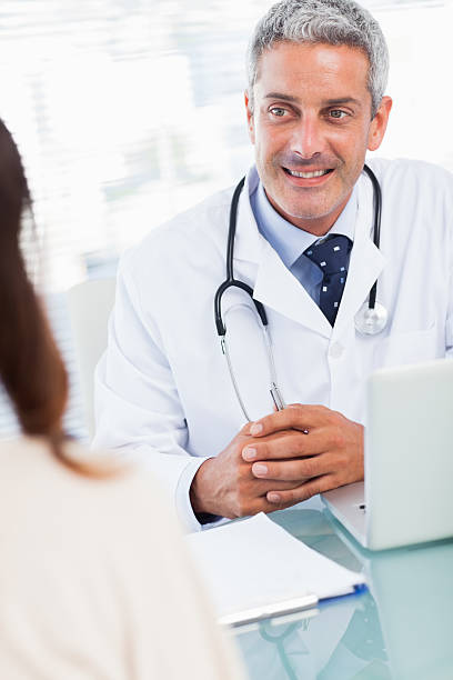 istock Doctor talking with his patient 497636381