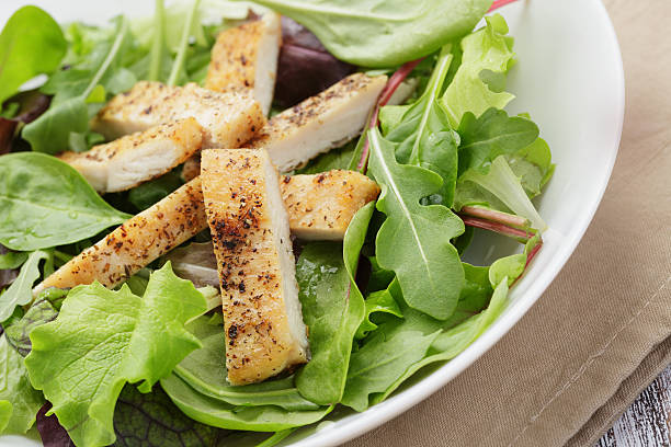 istock roasted chicken with mix salad 497636543