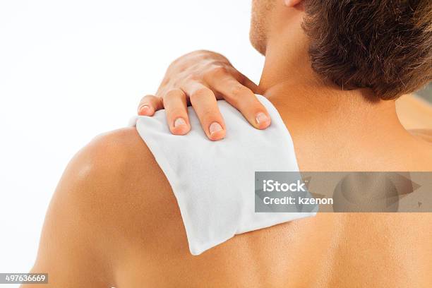 Young Man With Coolpack On His Shoulder Stock Photo - Download Image Now - Alternative Therapy, Heat - Temperature, Ice