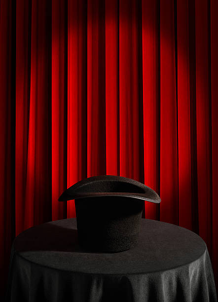 Red curtain and magical hat Red curtain, round table and magical hat magic show stock pictures, royalty-free photos & images