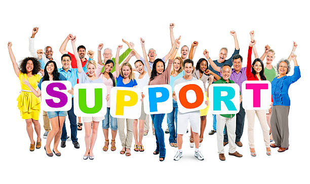 istock Multiethnic Arms Outstretched and Holding Word Support 497637645