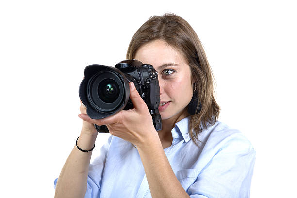 istock girl take a photo with digital camera 497638433