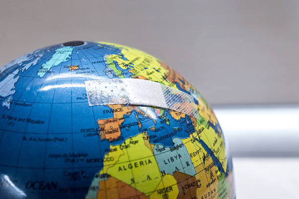 istock Globe with Bandaid/Plaster Over Europe Side View 497640102