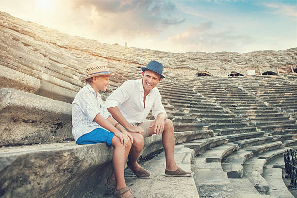 istock Father with son spent time together on the antique ruins 497640340