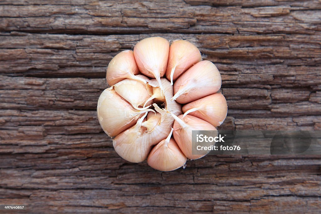 Garlic whole on the wooden background Close-up Stock Photo