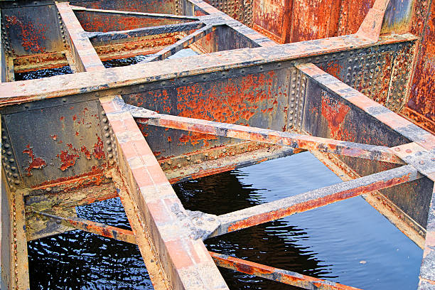istock Rusted bridge girders over water 497641247