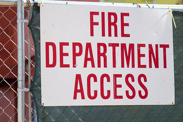 istock Fire Department Access sign on fence 497641568