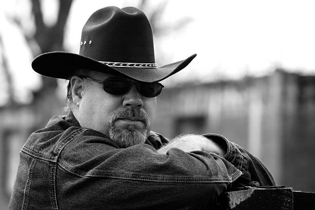 istock Black & White Image of Man Wearing Cowboy Hat 497651178