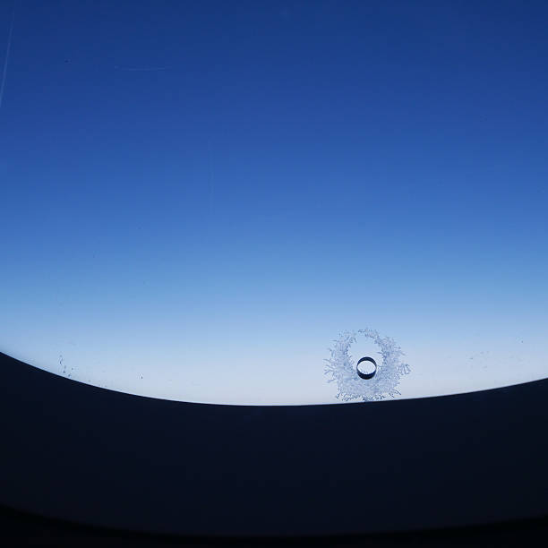 istock The little hole in airplane window (1) 497655928