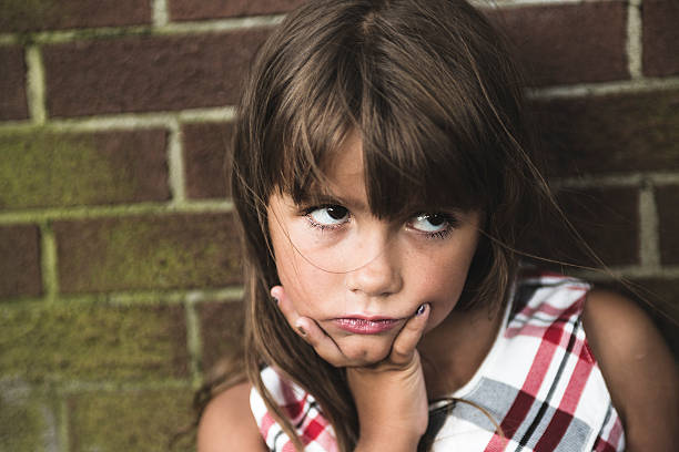 istock eight years old school girl 497656488