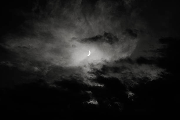 istock Dark Turbulent Storm Ominous Clouds and Half Moon 497662614