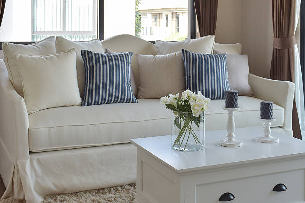 istock decorative flower in glass vase with striped pillows on sofa 497678150