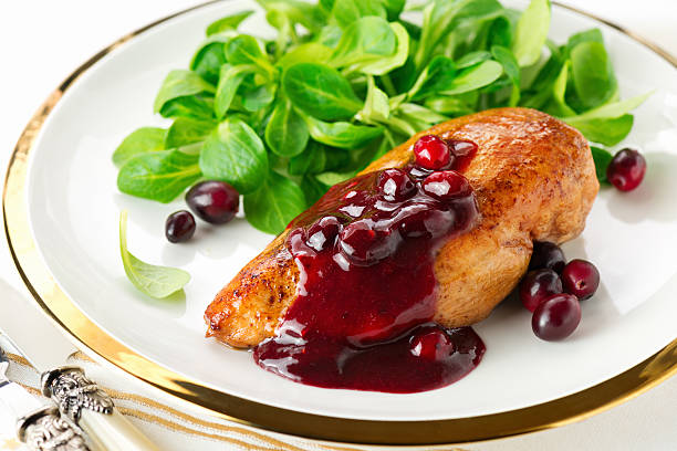 Chicken breast with cranberry sauce stock photo