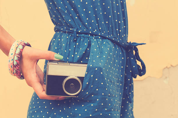 istock Hipster girl with old camera. 497680802
