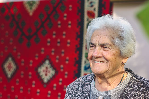 elderly woman in the glasses. Portrait of elderly woman index finger, 90 year old grandmother