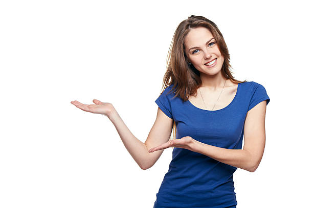 Smiling woman showing copy space Smiling woman showing open hand palm with copy space for product or text hand palm stock pictures, royalty-free photos & images