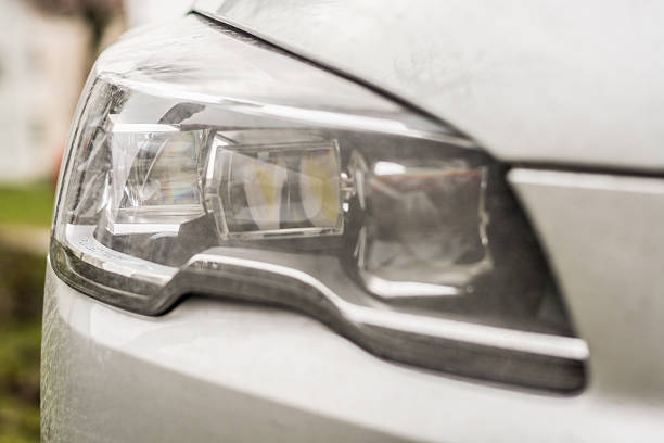 istock Close-up on a car headlight. Moder car exterrior. 497684060