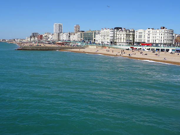 istock Image of Brighton seafront and sandy-beach, hotels, shops and tourists 497684424