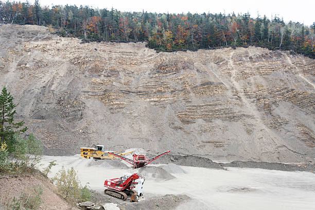 istock Excavator and heavy equipment in stone-pit 497685008