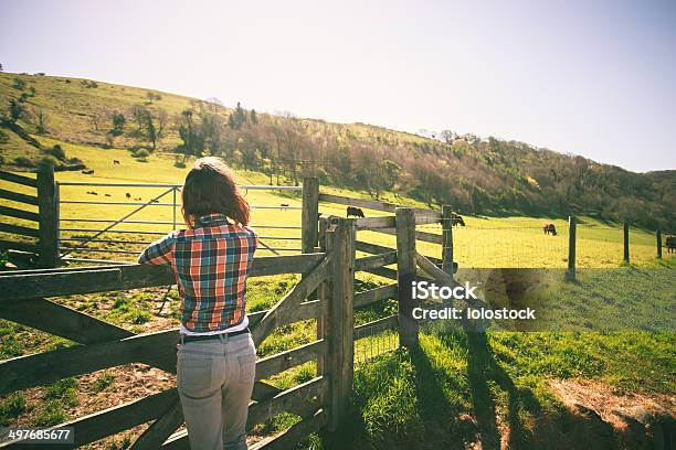 Young Woman By A Fence On A Ranch Stock Photo - Download Image Now - Adult, Agriculture, Beauty In Nature