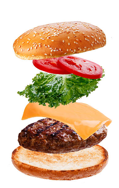 istock delicious burger with flying falling ingredients on white background 497686742