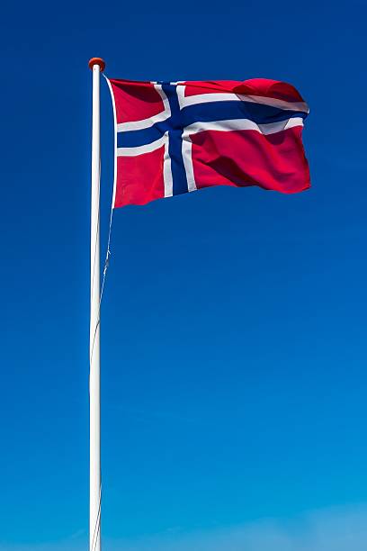 istock Norwegian flag on the blue sky 497687676