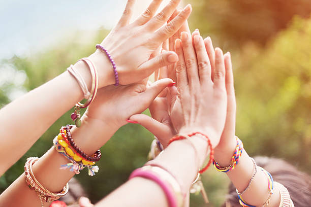 Close up of female hands Close up of female hands bracelet photos stock pictures, royalty-free photos & images