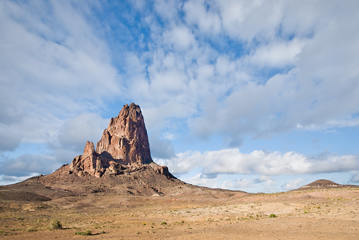 Agathla Peak (7096') is one of many interesting diatreme rock formations in the Monument Valley area. This volcanic pipe was formed when magma rose through a crack in the Earth's crust and made contact with a shallow body of ground water. Agathla Peak is located in Navajo County just north of Kayenta, Arizona, USA.