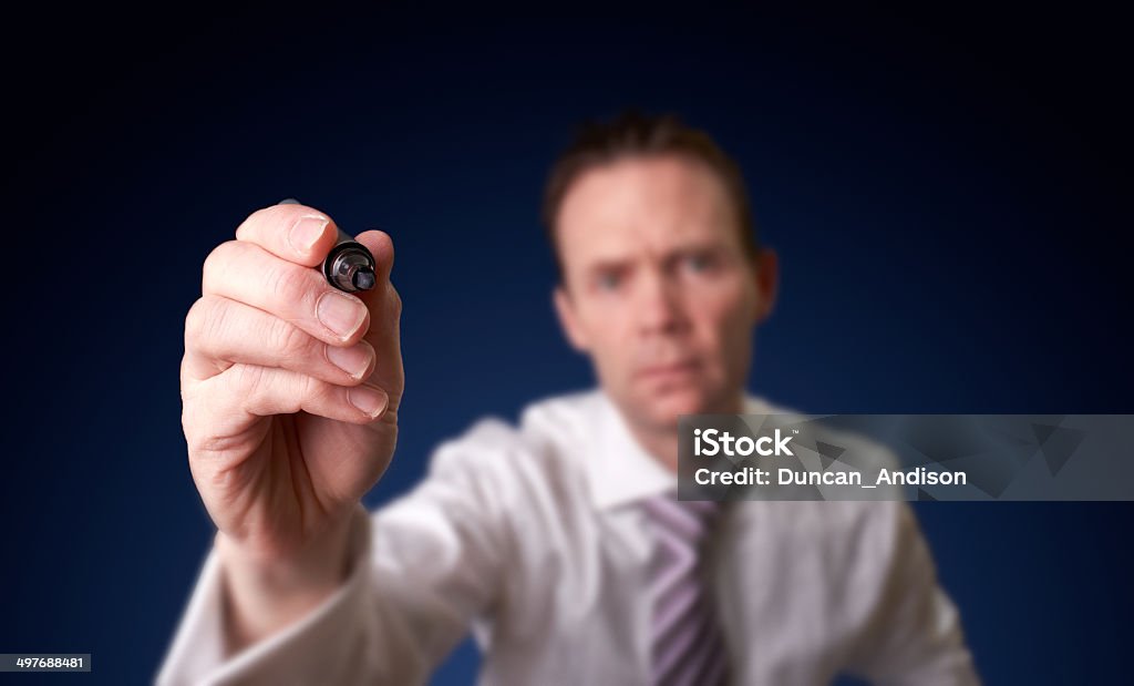 Businessman writing. Businessman writing, drawing on the screen Corporate Business Stock Photo