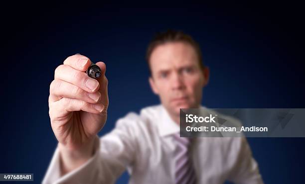 Businessman Writing Stock Photo - Download Image Now - Corporate Business, Dark, Instructor