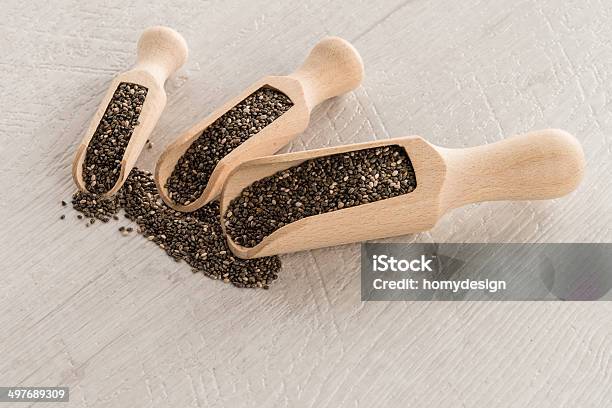 Chia Seeds In Wooden Scoops Stock Photo - Download Image Now - Antioxidant, Backgrounds, Chia seed