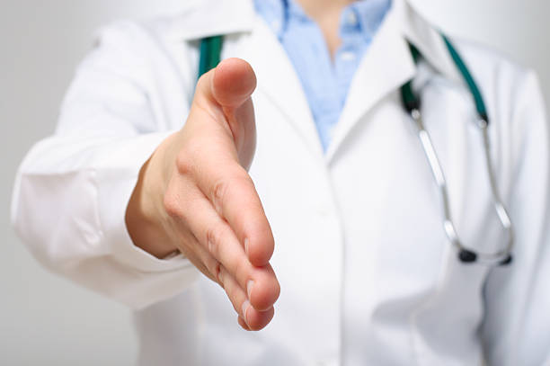istock Female doctor offering her handshake 497690211