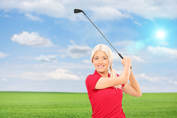 istock Woman playing golf in a field 497690339