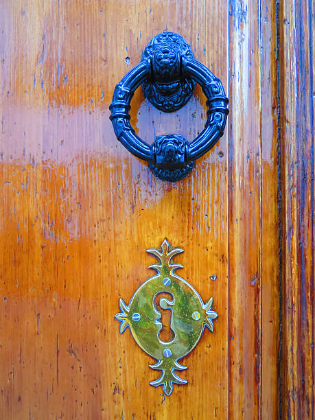 istock Door knocker and fake keyhole 497701152