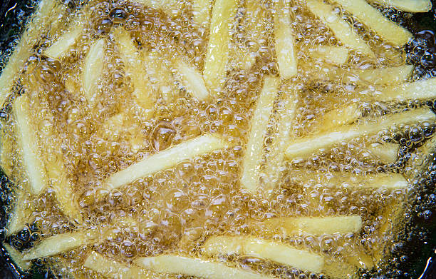 istock French fried potatoes frying in boiling oil 497704594
