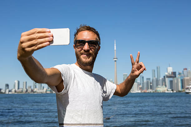 istock Tourist in Toronto-Canada taking a selfie portrait 497705230