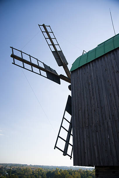 istock Windmill standing in the field against the blue sky 497705718